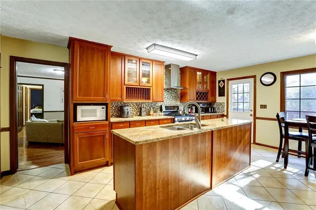 a bathroom with a sink and a mirror with toilet