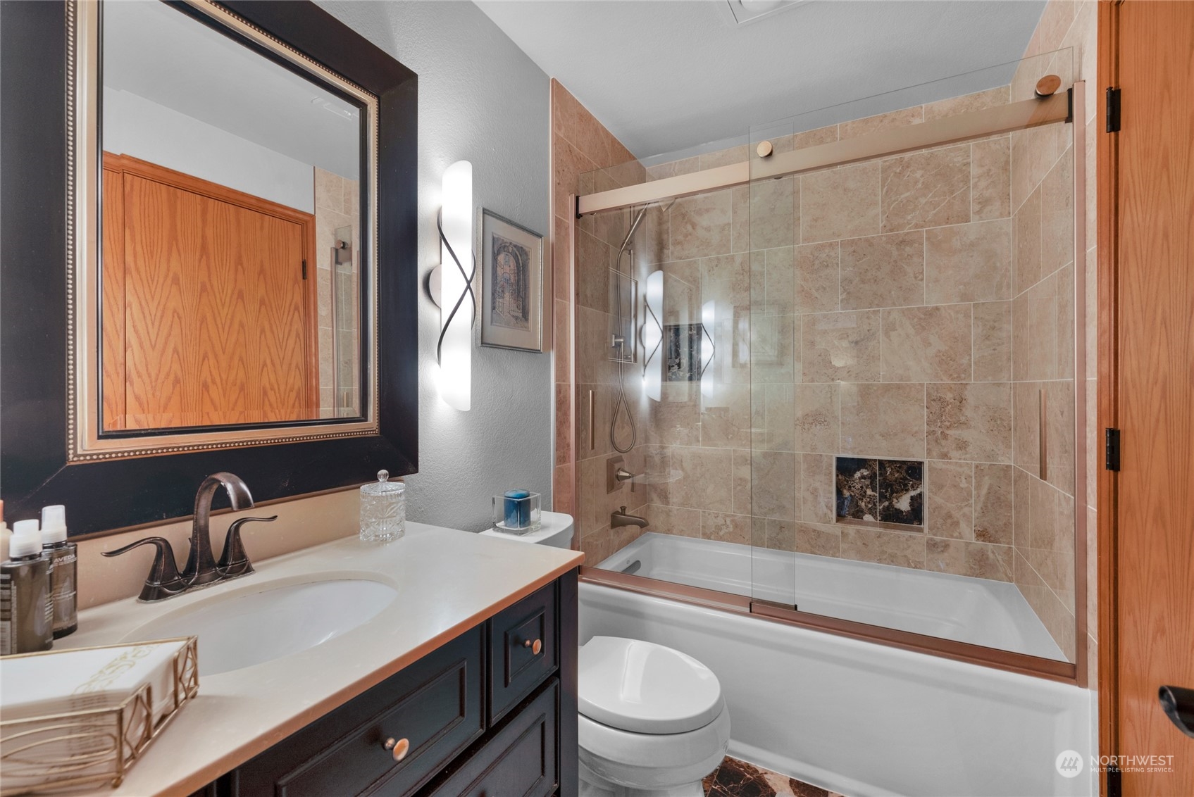 2529 166th Place Southeast Bothell, WA 98012 - Photo 16 of 35 a bathroom with a bathtub shower sink vanity mirror and toilet