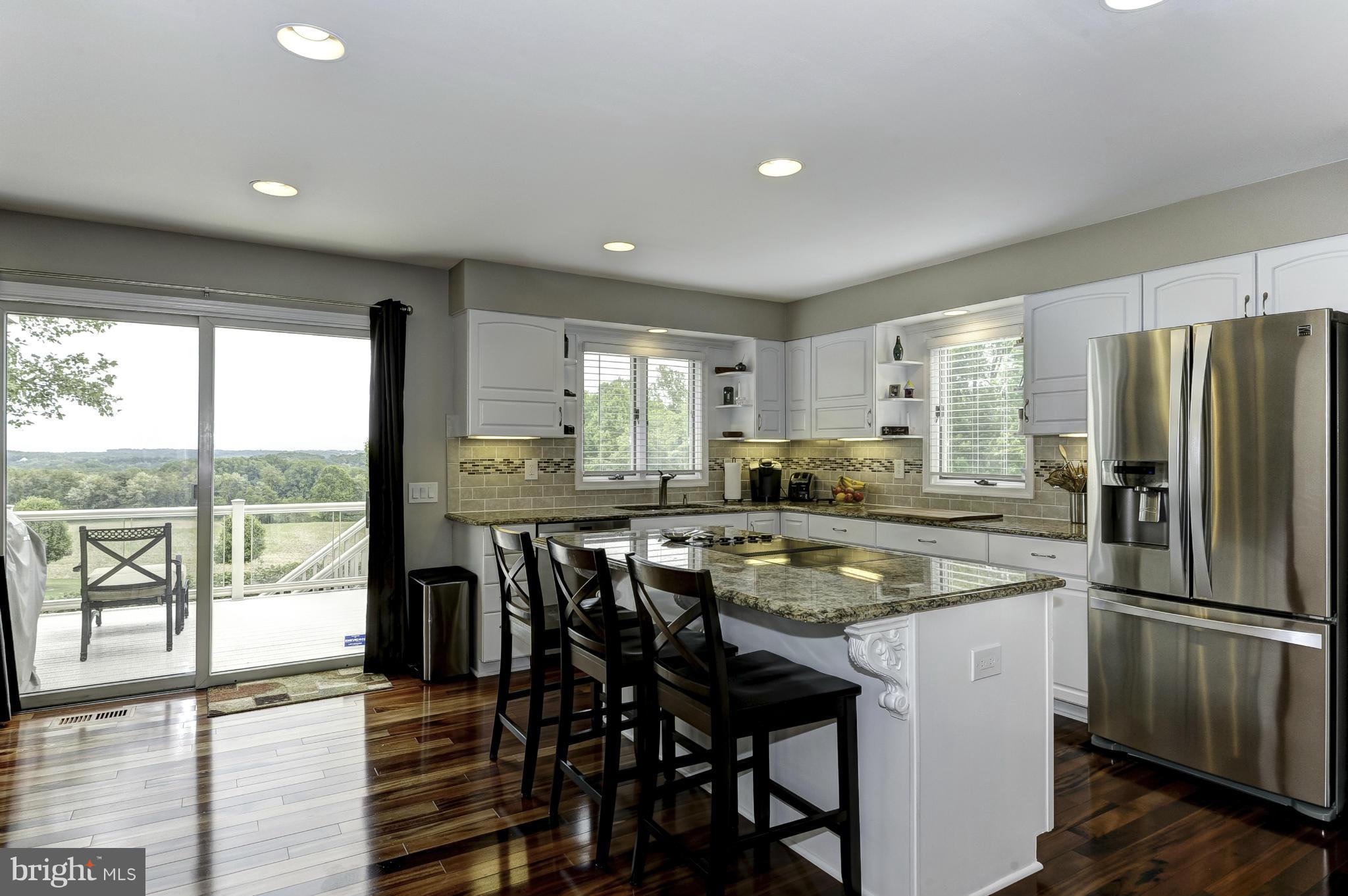 22701 Wildcat Road Germantown, MD 20876 - Photo 12 of 30 Kitchen with view of breakfast area and deck