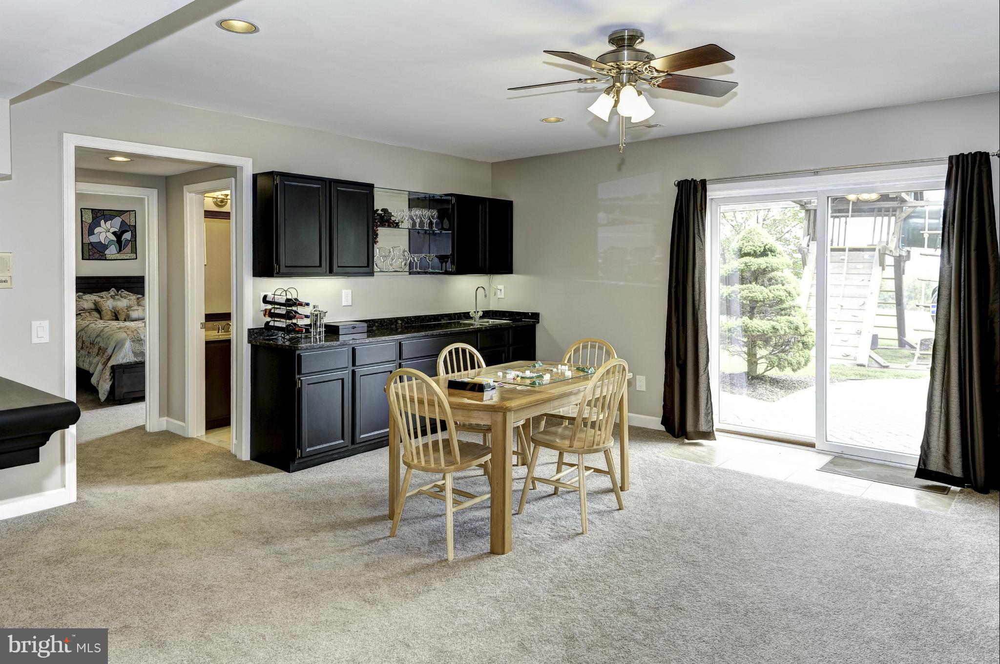 22701 Wildcat Road Germantown, MD 20876 - Photo 21 of 30 Recreation room - reverse view of walk-up bar