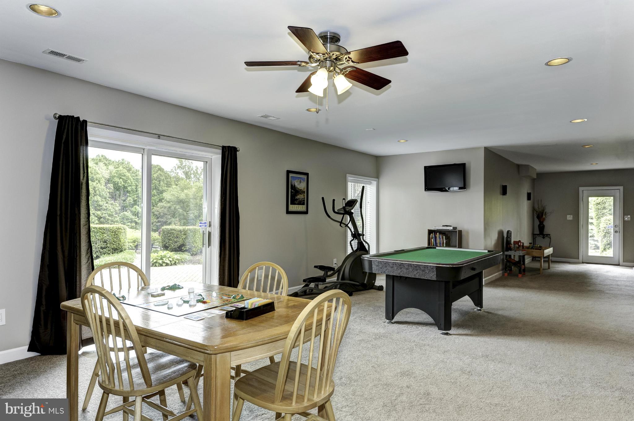 22701 Wildcat Road Germantown, MD 20876 - Photo 23 of 30 Recreation room with walk-out to rear yard