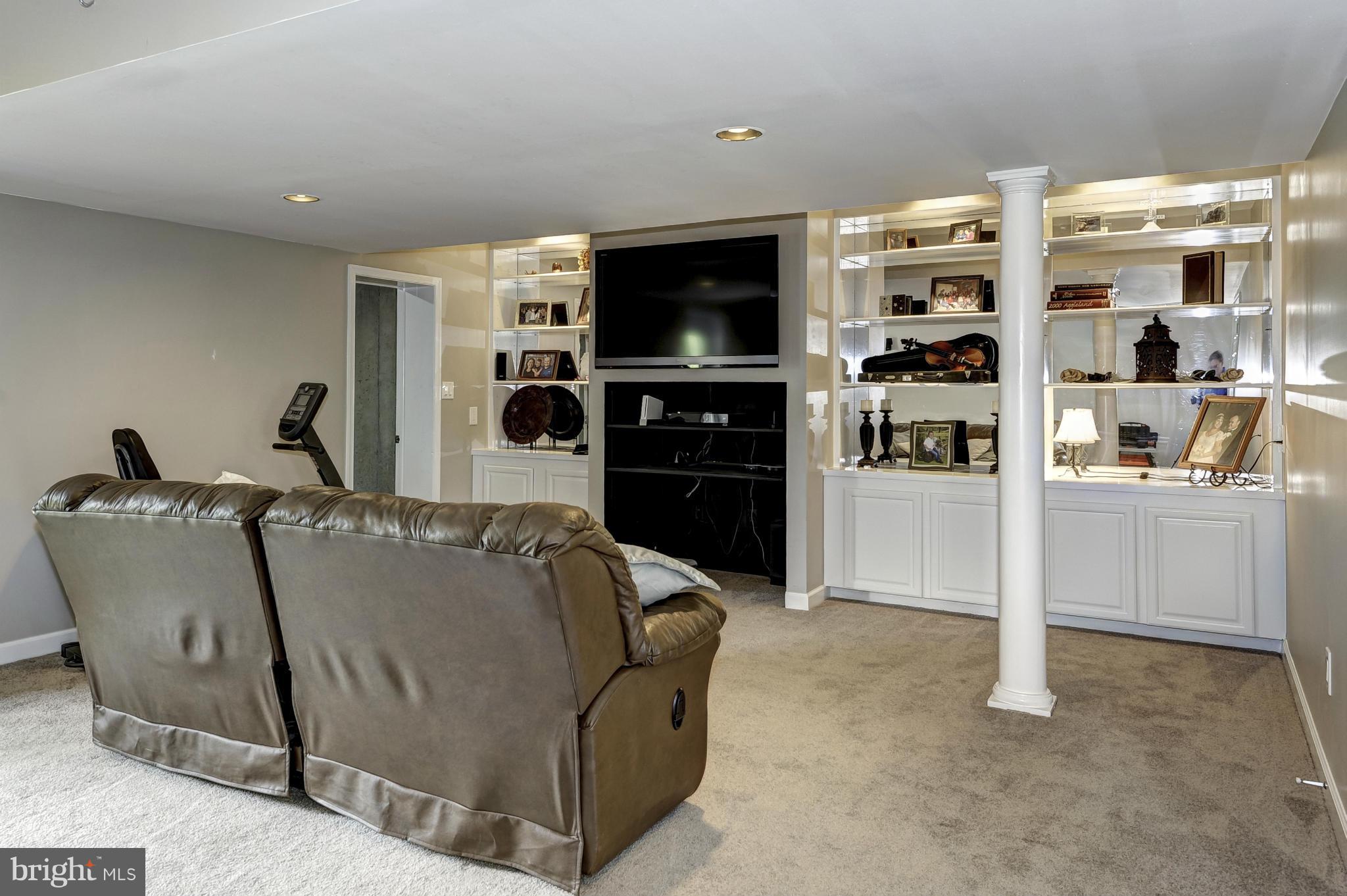 22701 Wildcat Road Germantown, MD 20876 - Photo 24 of 30 Recreation room has entertainment area w/built-ins