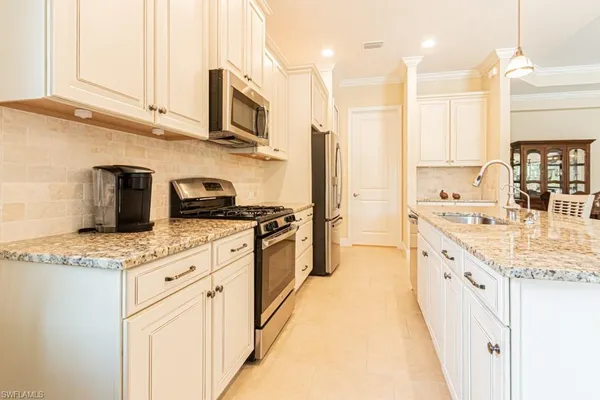 a bathroom with double sink and a mirror