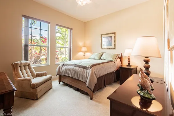 a bedroom with a bed and a desk