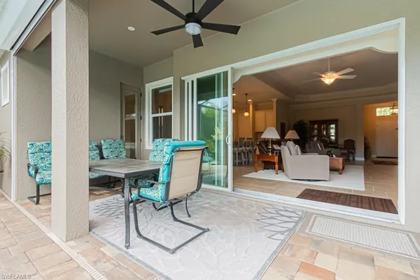 a view of swimming pool with outdoor seating