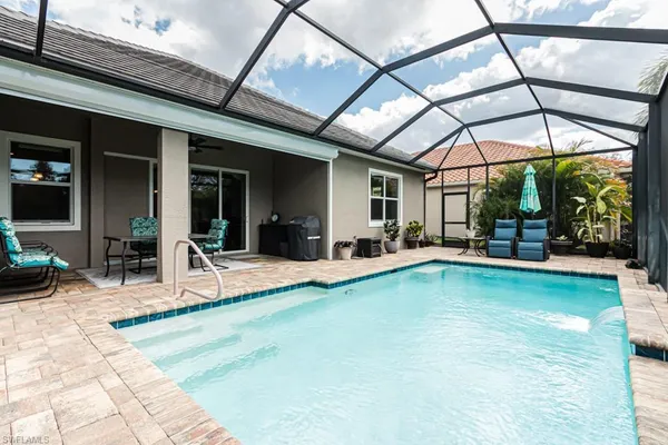 a view of a swimming pool with a patio