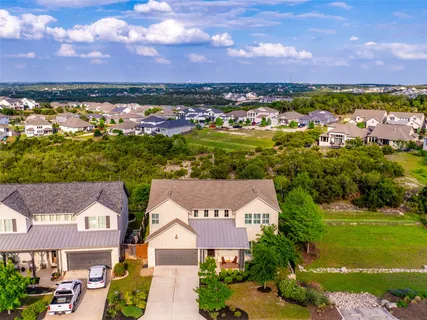 an aerial view of residential houses and outdoor space