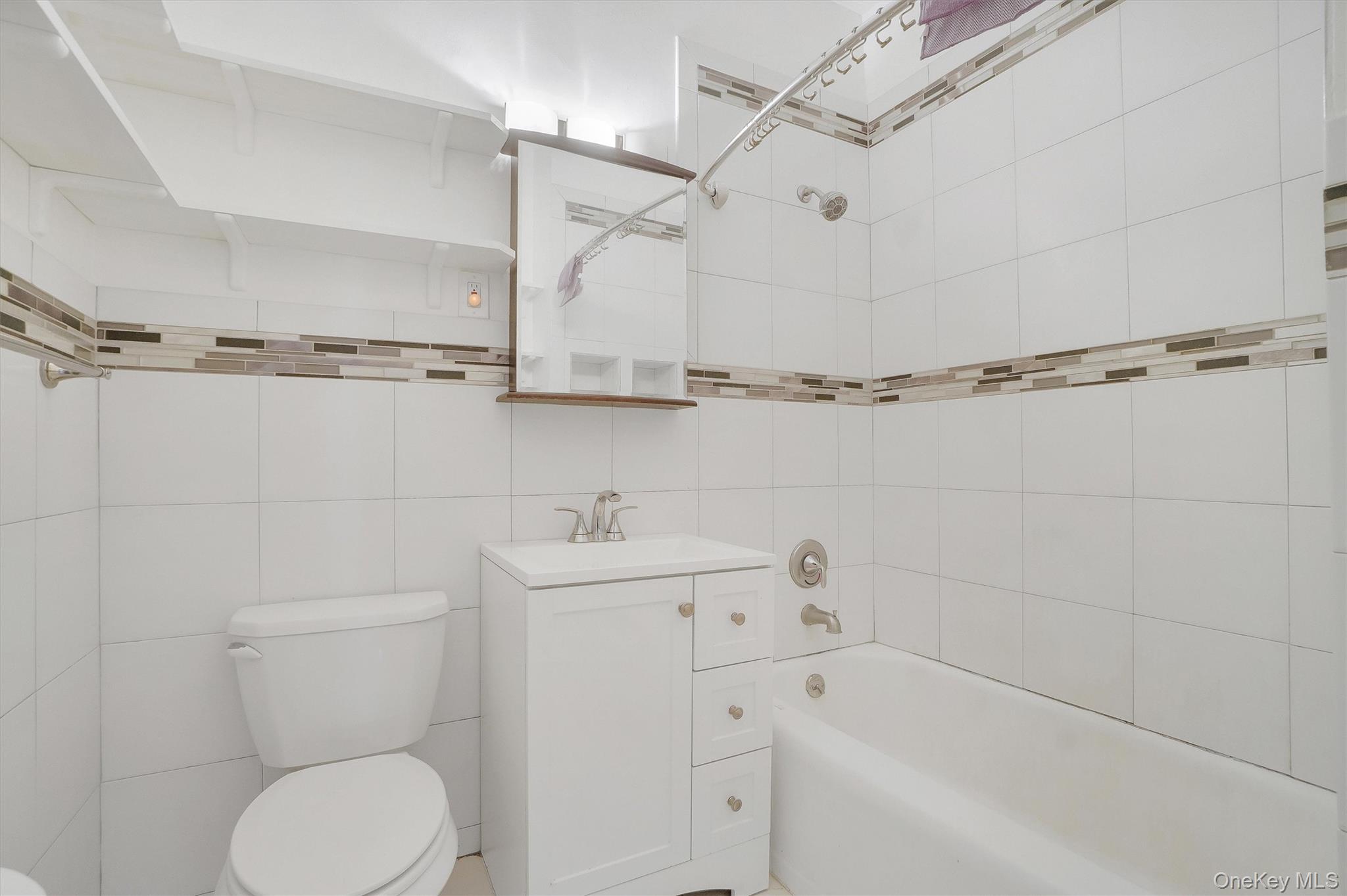 357 Dyckman Street Peekskill, NY 10566 - Photo 18 of 48 a bathroom with a toilet sink and bathtub