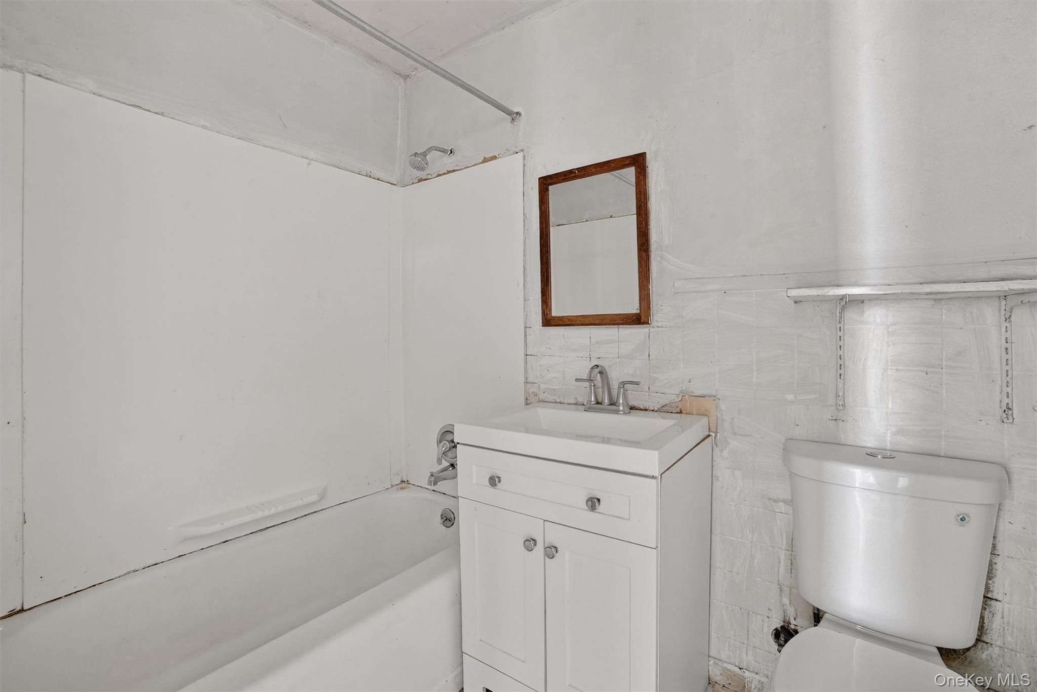 357 Dyckman Street Peekskill, NY 10566 - Photo 28 of 48 a bathroom with a granite countertop sink toilet and shower