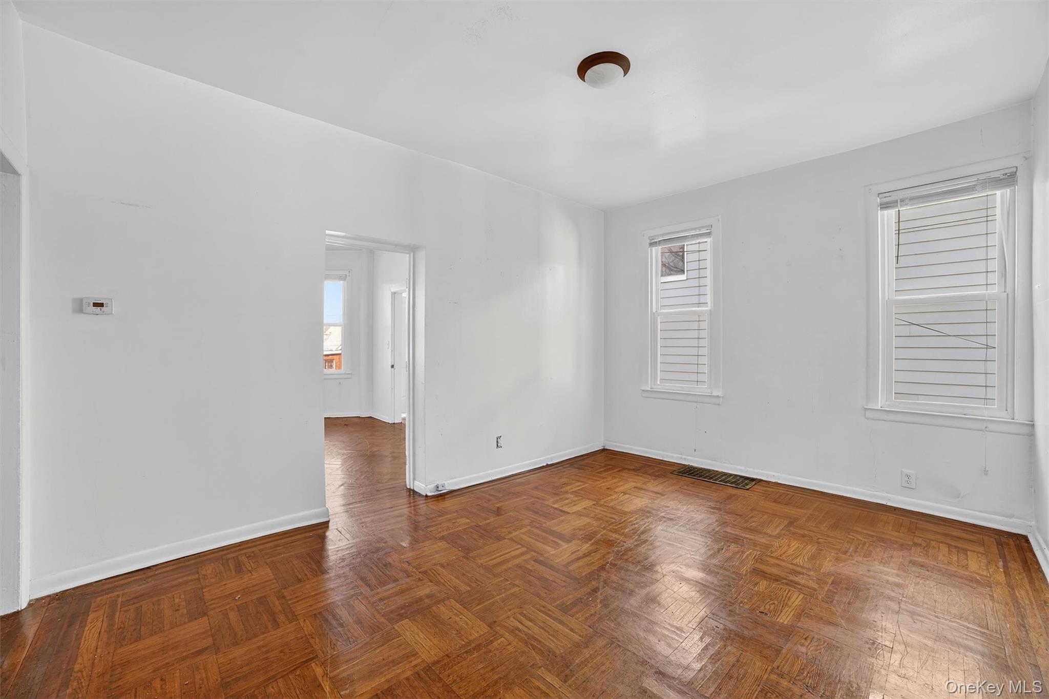 357 Dyckman Street Peekskill, NY 10566 - Photo 34 of 48 a view of an empty room with wooden floor and a window