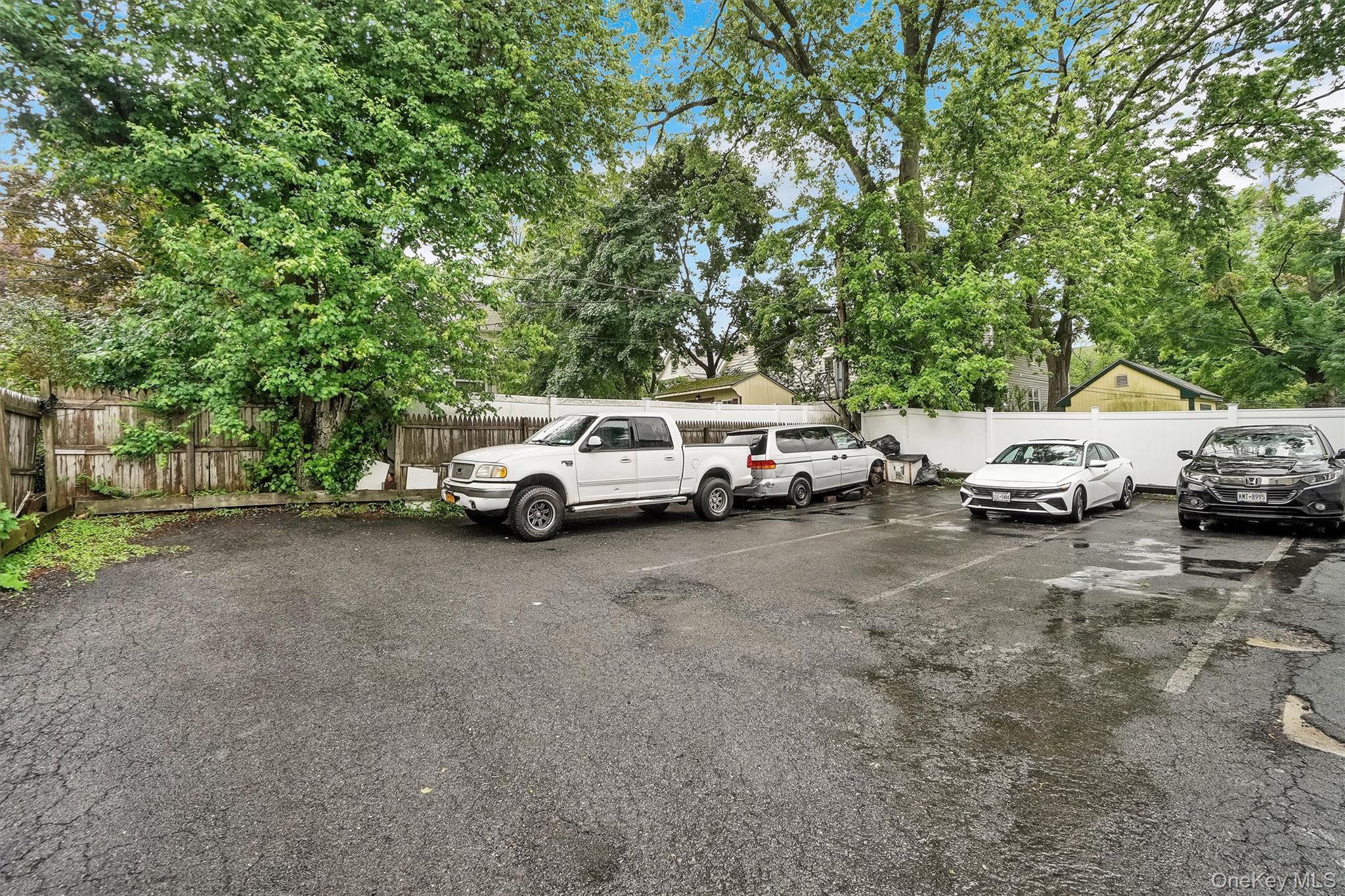 357 Dyckman Street Peekskill, NY 10566 - Photo 41 of 48 a white house with a car parked in front of it