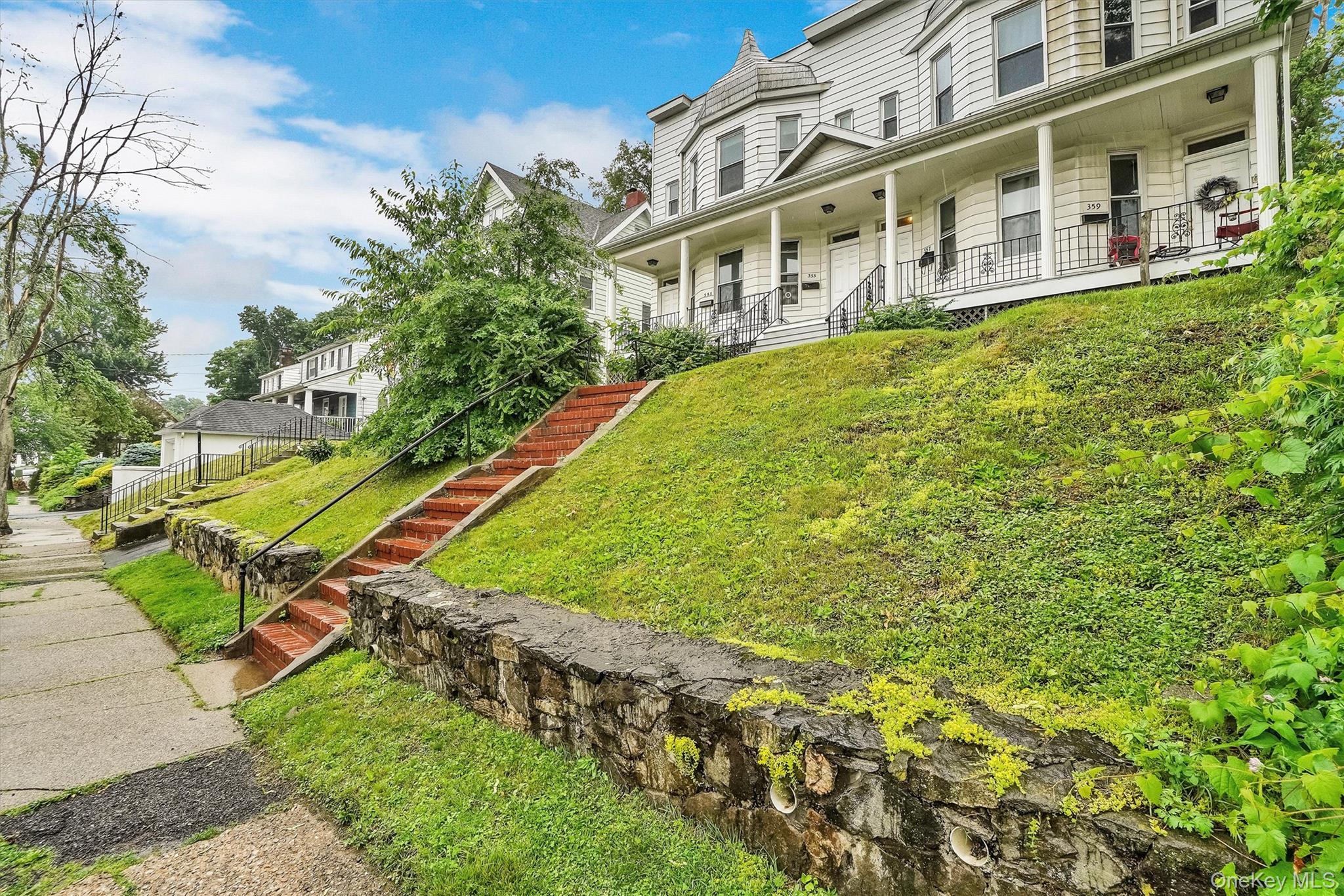 357 Dyckman Street Peekskill, NY 10566 - Photo 5 of 48 a view of a building with a yard