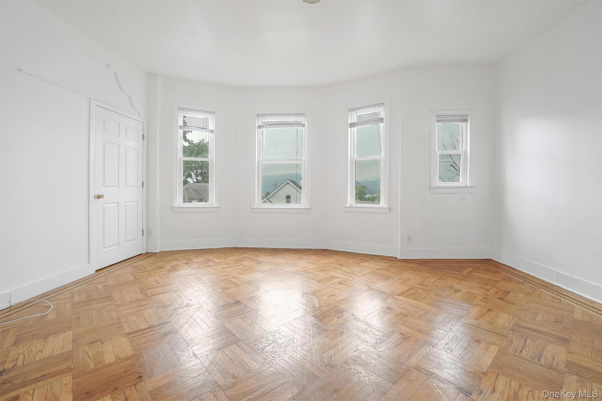 357 Dyckman Street Peekskill, NY 10566 - Photo 7 of 48 an empty room with windows