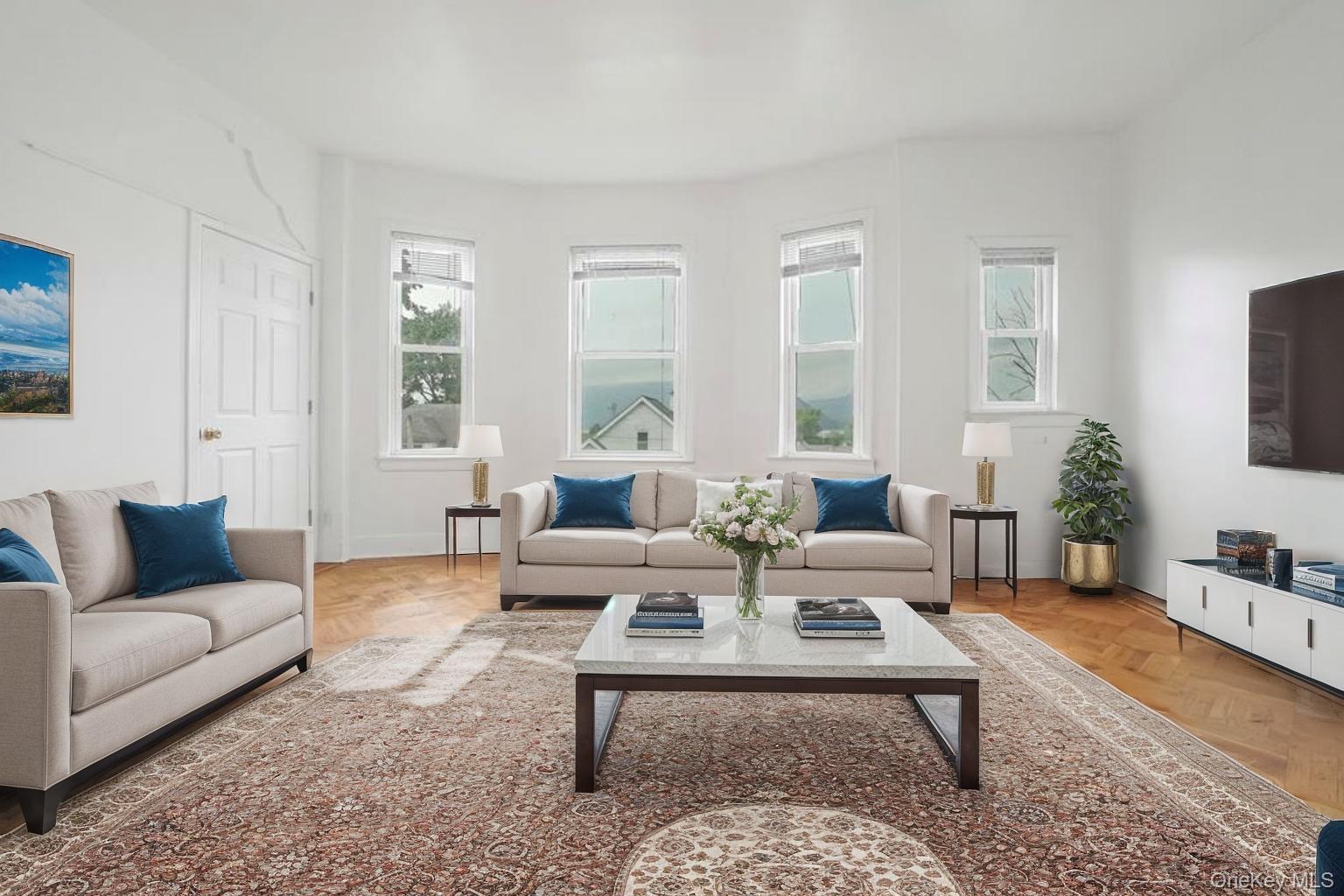 357 Dyckman Street Peekskill, NY 10566 - Photo 8 of 48 a living room with furniture a rug a lamp and a window