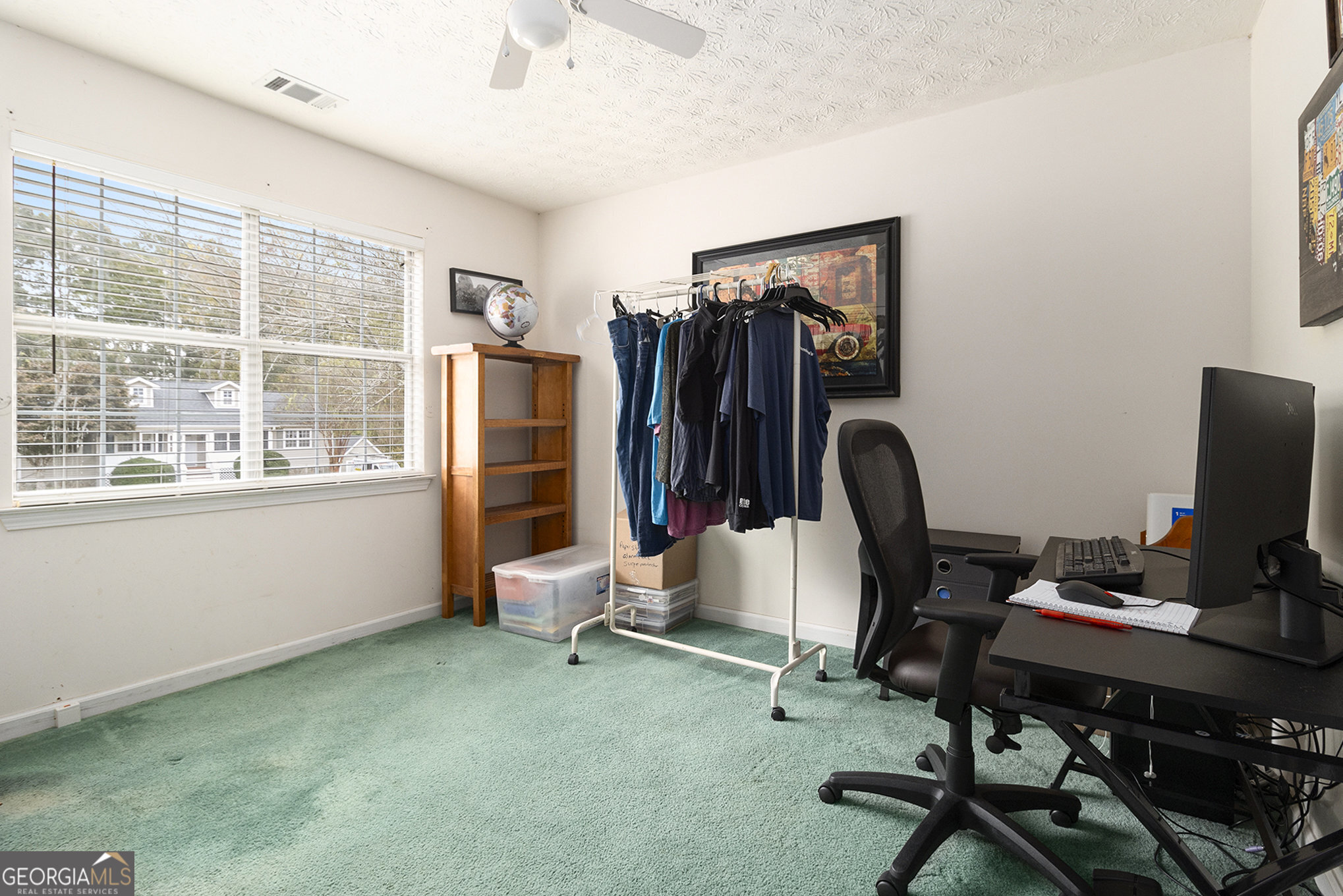 248 Fern Court Hampton, GA 30228 - Photo 18 of 20 a view of a workspace with furniture and a window
