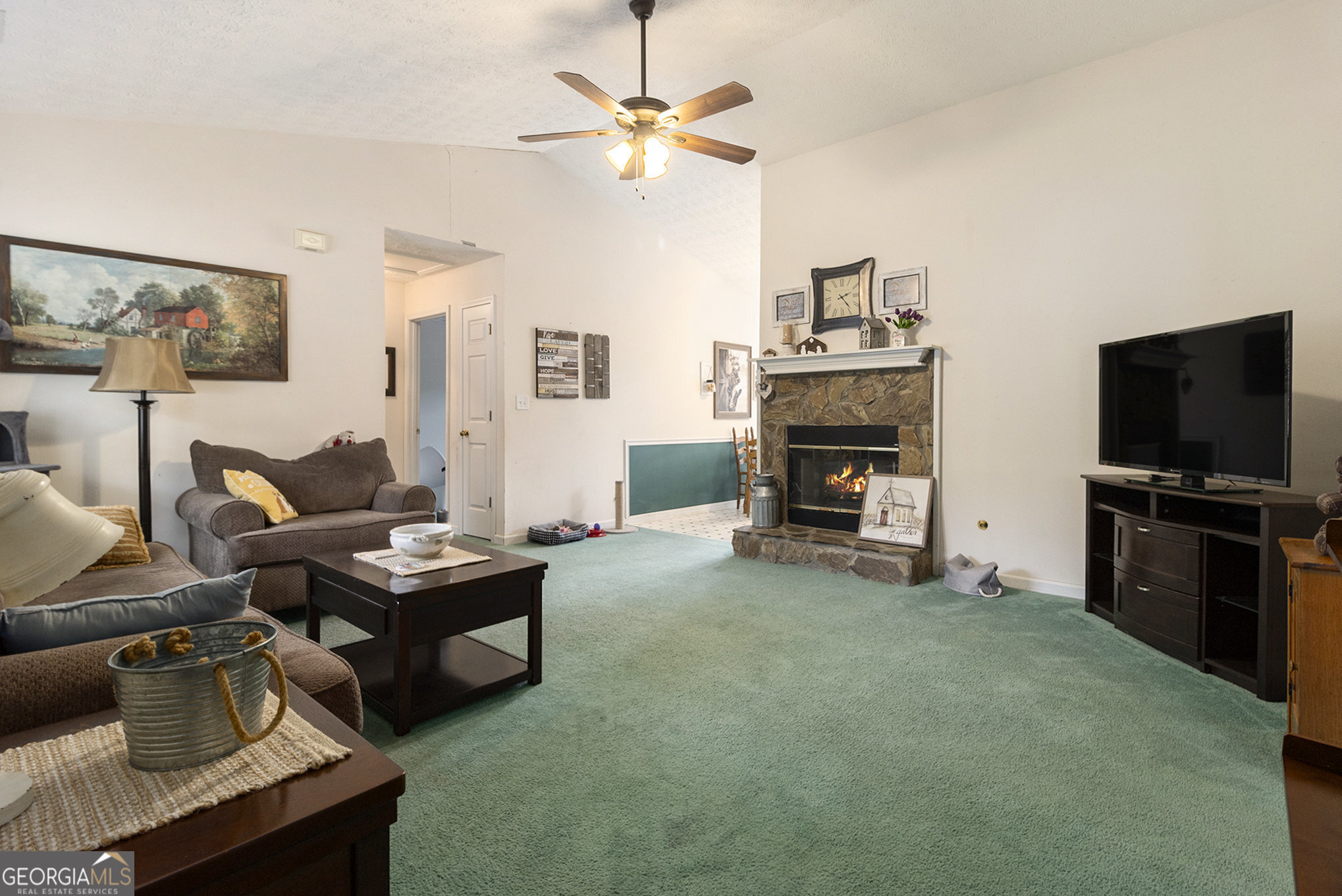 248 Fern Court Hampton, GA 30228 - Photo 8 of 20 a living room with furniture and a flat screen tv