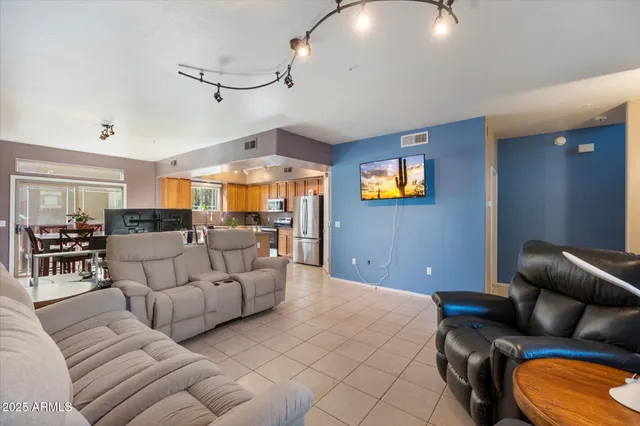 a living room with furniture and a large window