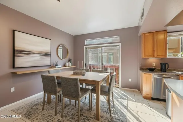a view of a dining room with furniture and window