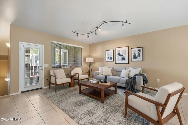 a living room with furniture and a window