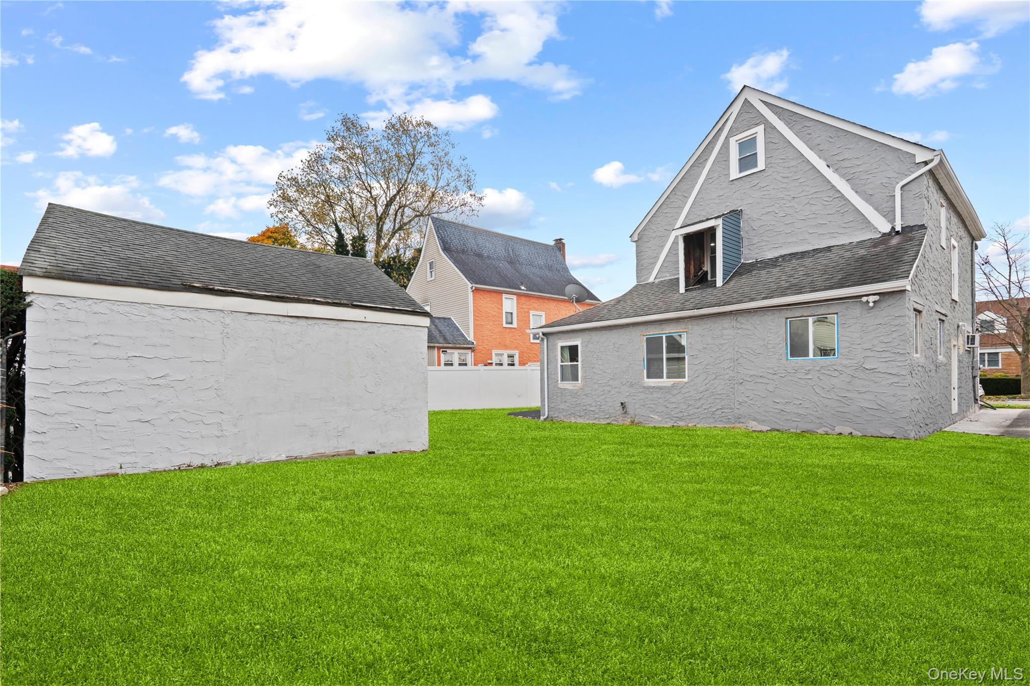 28 Cornwall Lane Hempstead, NY 11550 - Photo 3 of 20 a front view of a house with a garden