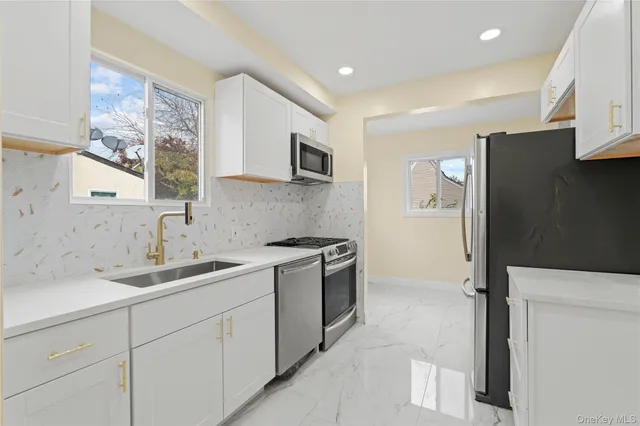 a kitchen with a sink and a refrigerator