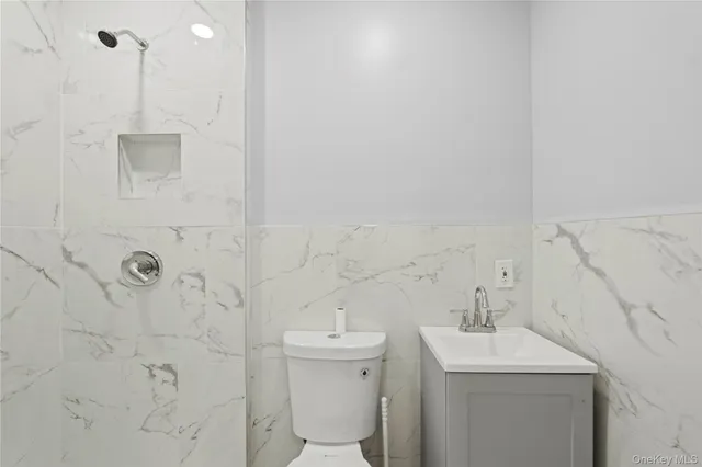 a bathroom with a sink toilet and vanity