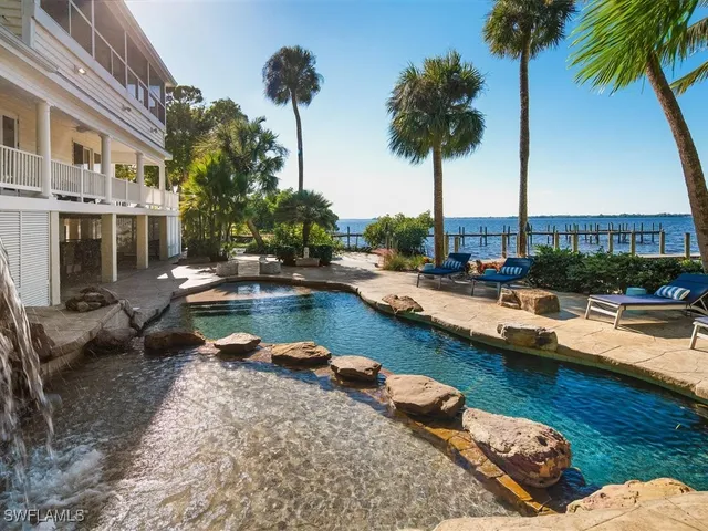 a view of swimming pool with chairs