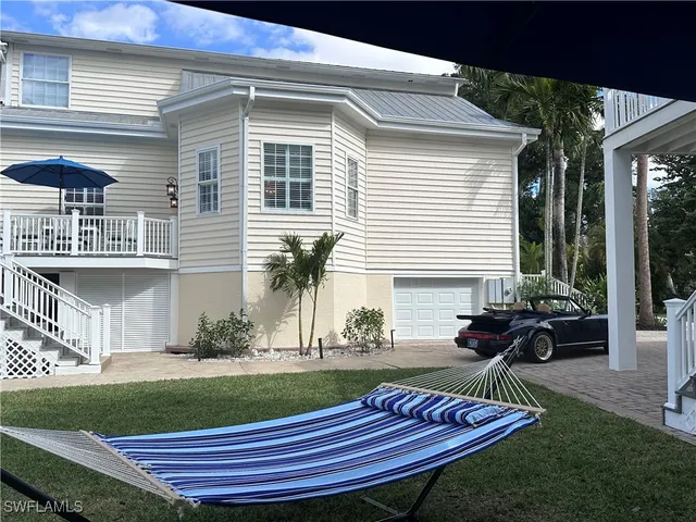 a kitchen with a sink a stove a dining table and chairs