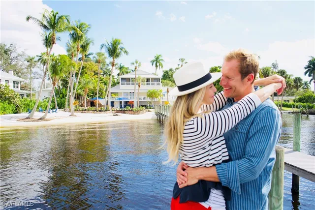 a view of swimming pool with outdoor seating and wooden floor