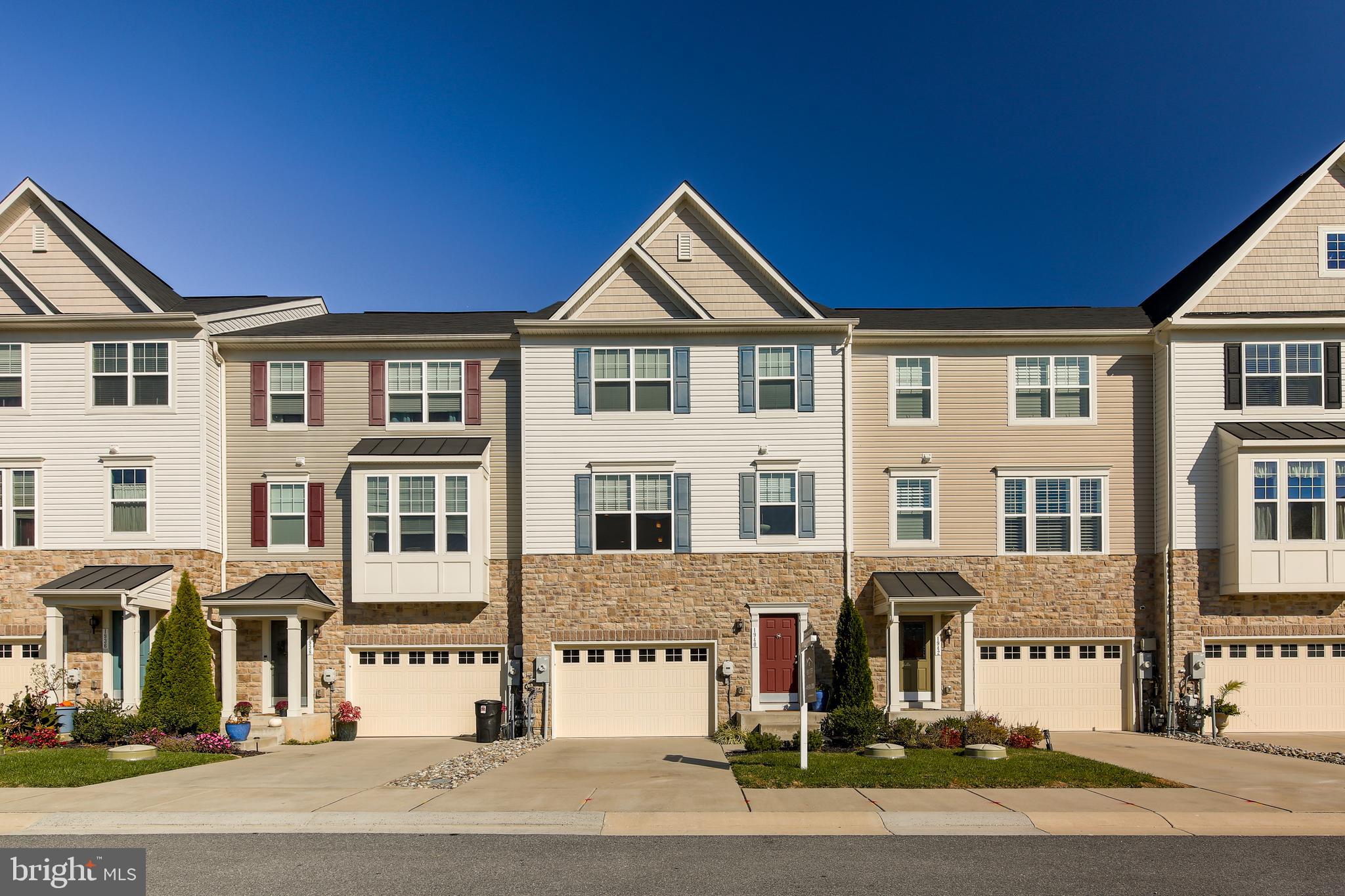 1940 River Vista Drive Baltimore, MD 21221 - Photo 2 of 50 Large townhouse with red door.