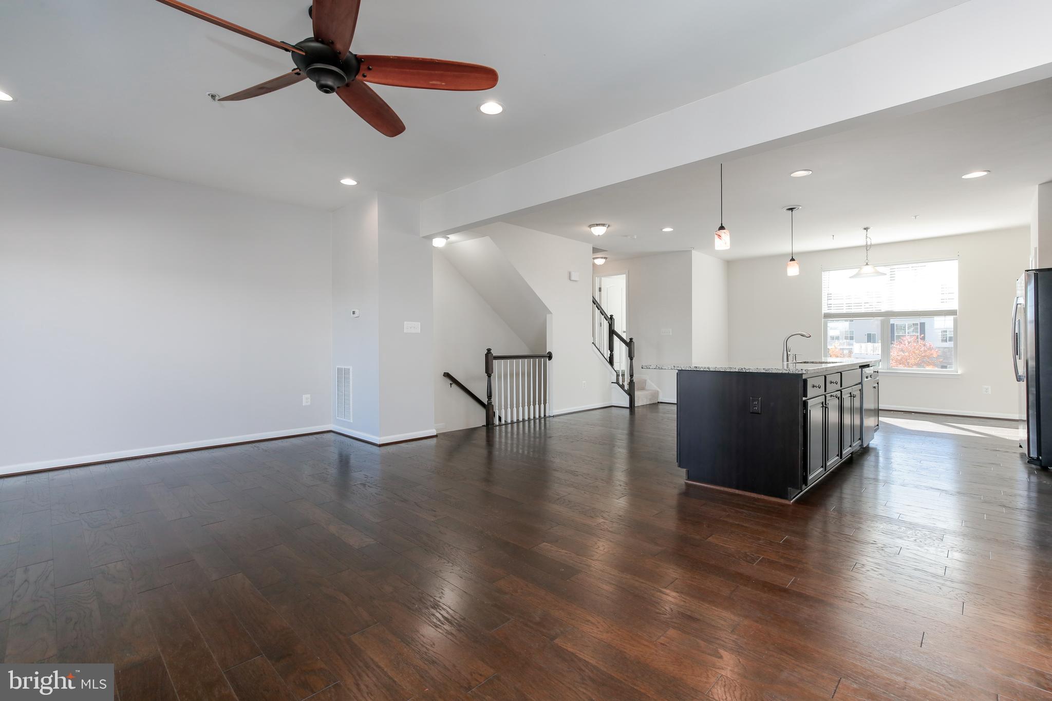 1940 River Vista Drive Baltimore, MD 21221 - Photo 9 of 50 Wood floors and ceiling fan