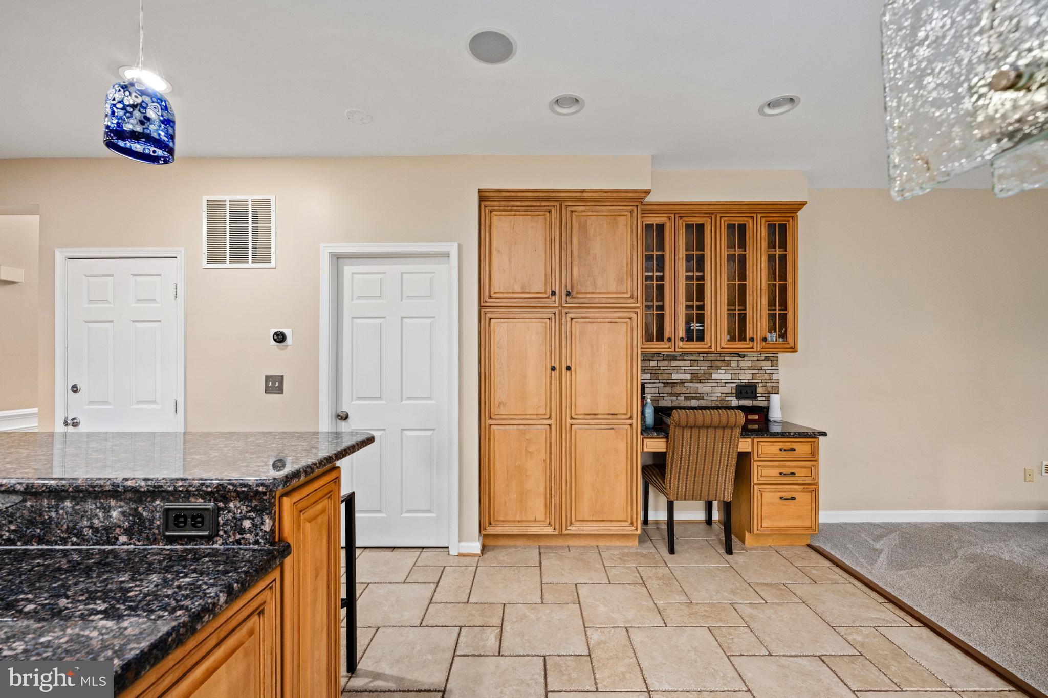 43232 Wayside Circle Ashburn, VA 20147 - Photo 33 of 105 a kitchen with granite countertop a stove a sink and a refrigerator