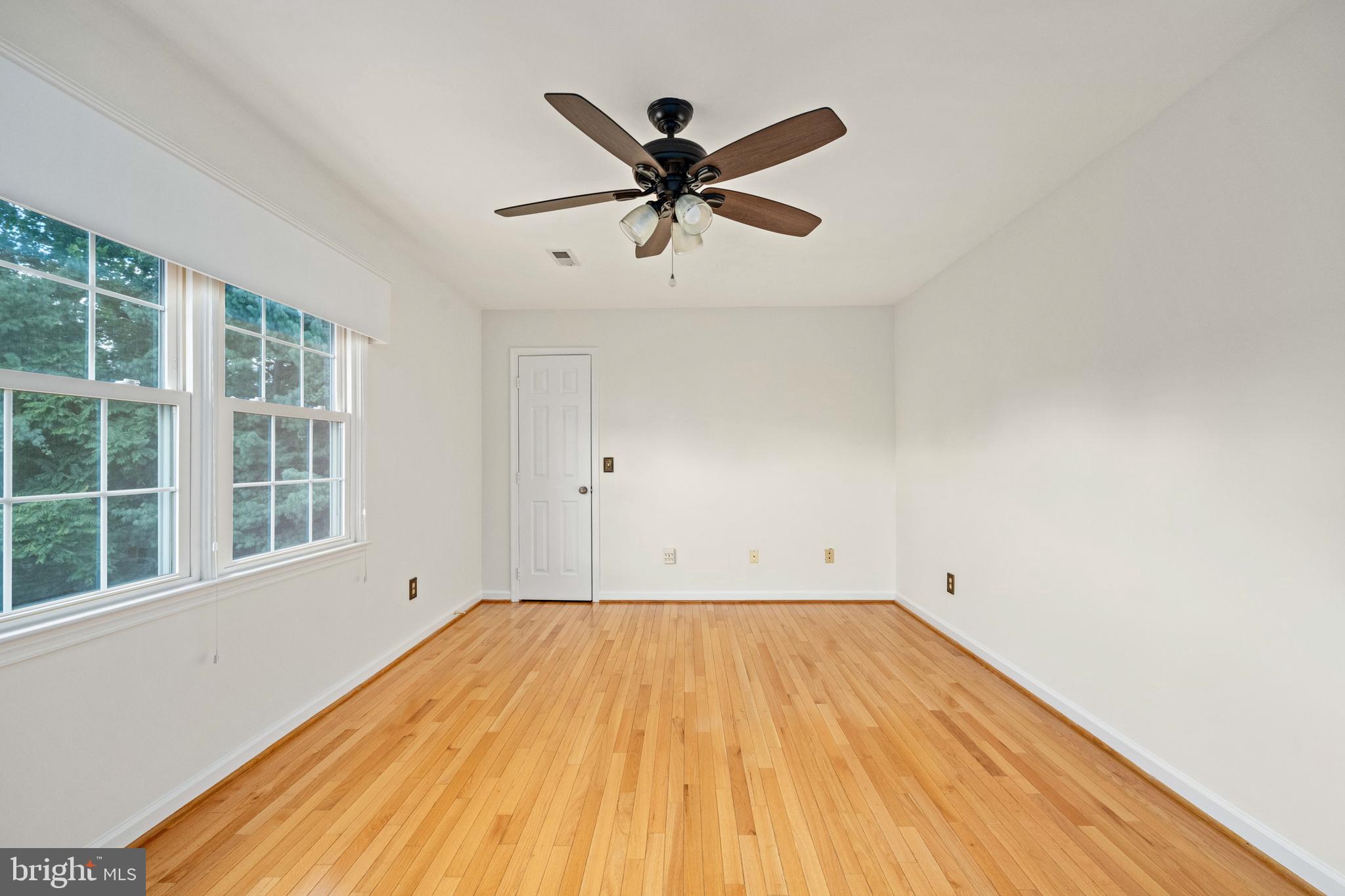43232 Wayside Circle Ashburn, VA 20147 - Photo 58 of 105 a view of empty room with wooden floor and fan