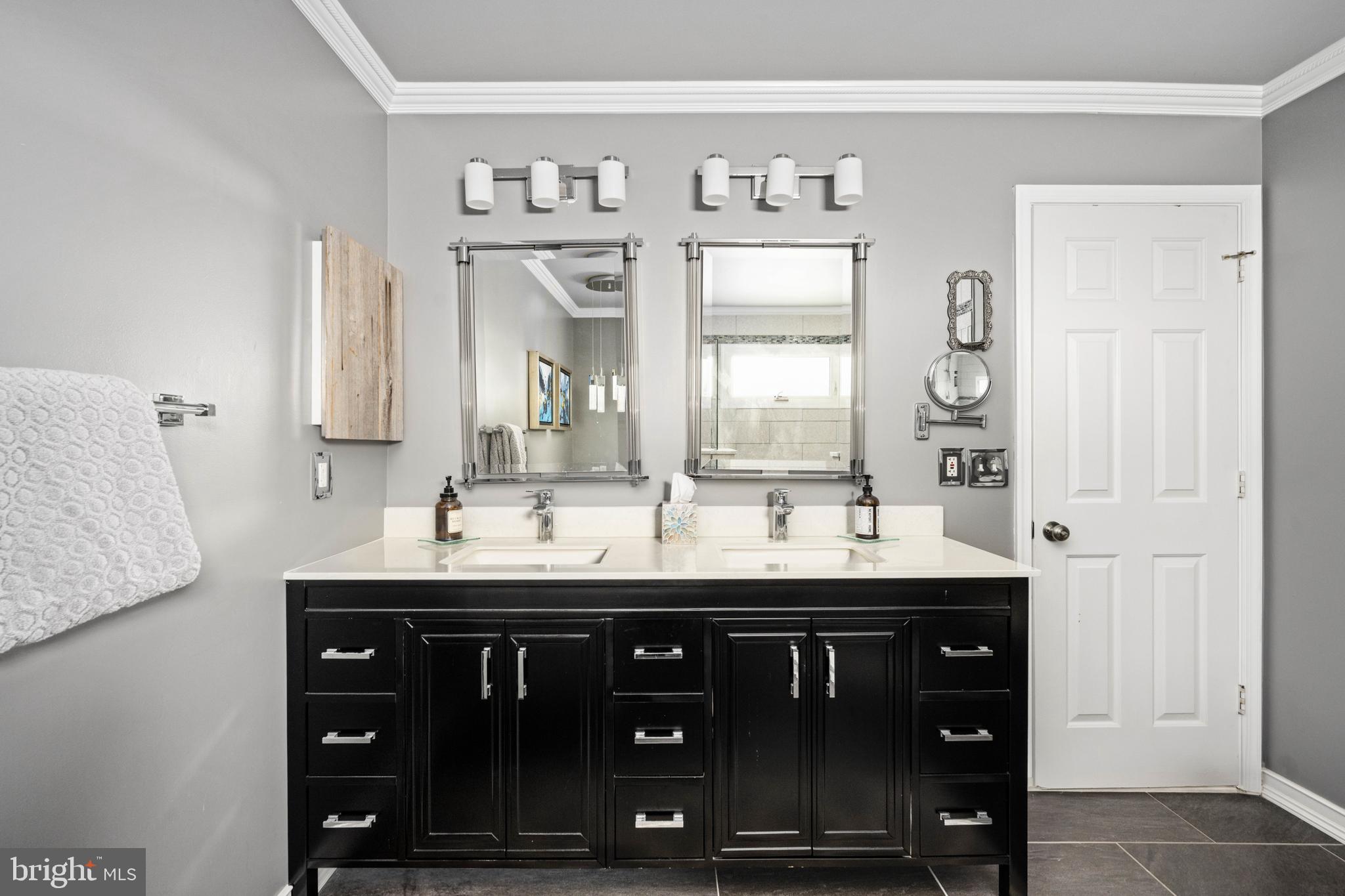 43232 Wayside Circle Ashburn, VA 20147 - Photo 84 of 105 a bathroom with a granite countertop double vanity sink and a mirror