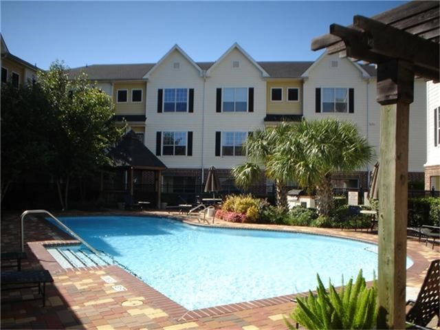 9200 Westheimer Road, Unit 1308 Houston, TX 77063 - Photo 11 of 12 a front view of a house with garden