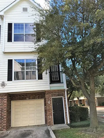 a front view of a house with a garage