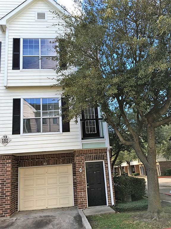 9200 Westheimer Road, Unit 1308 Houston, TX 77063 - Photo 2 of 12 a front view of a house with a garage