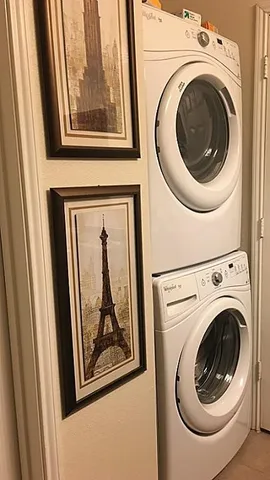 a view of a hallway with washer and dryer