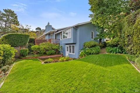 an aerial view of ocean with residential house with outdoor space