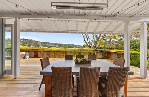 a view of a backyard with sitting area