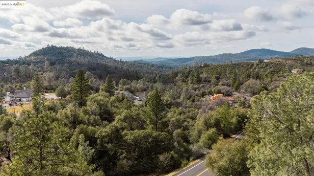 a view of a city with mountains in the background