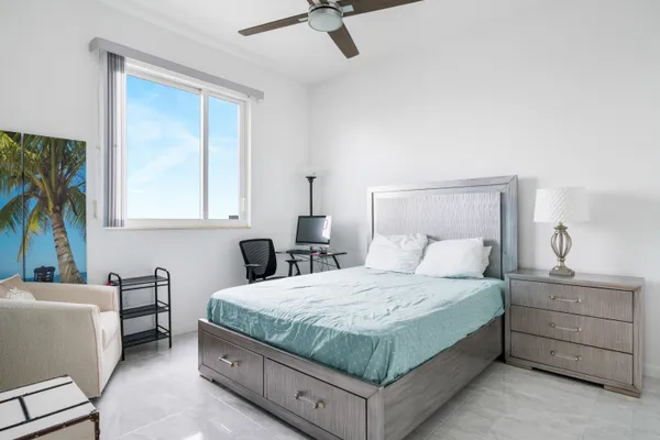 a bedroom with a bed and a couch