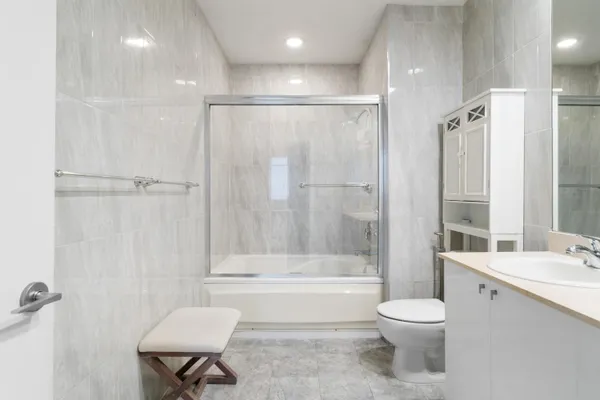 a bathroom with a toilet a sink and a bathtub