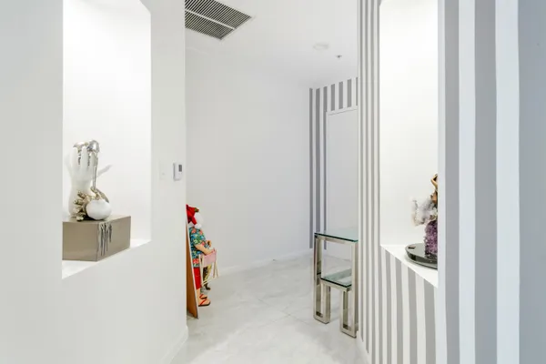 a room with a cabinet and a mirror