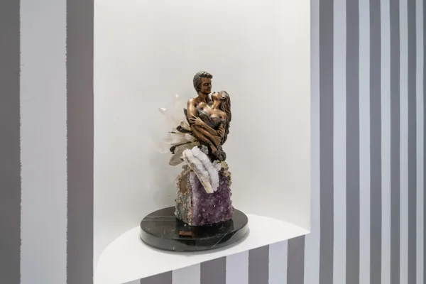 a vase of flowers sitting on a table