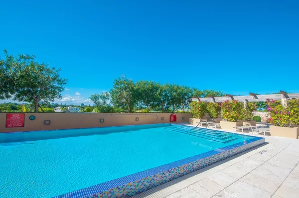 a view of a pool and outdoor space