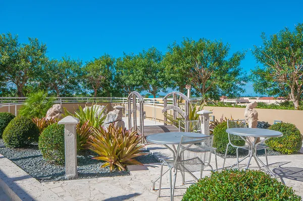 a view of a chairs and table on the terrace