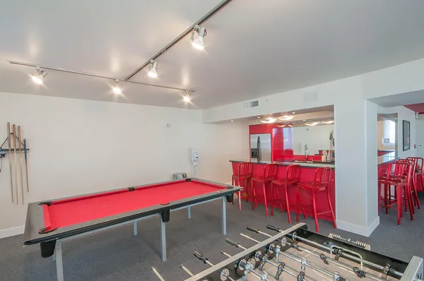 a view of a room with gym equipment and floor to ceiling window