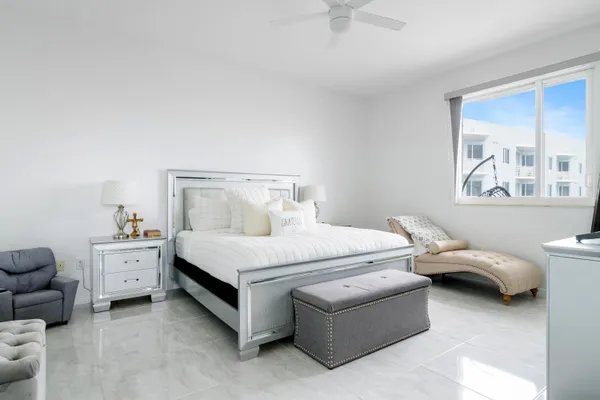 a bedroom with a bed and a couch