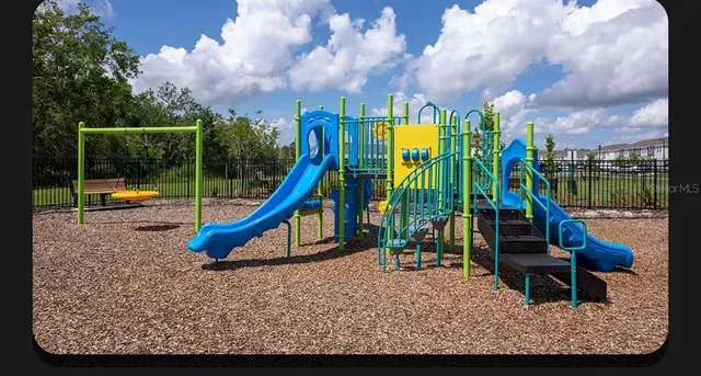 a view of a park with a slide